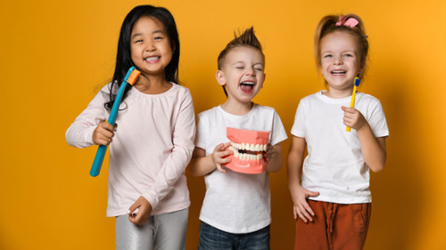 A group of kids smiling after a preventive visit in Weatherford, TX